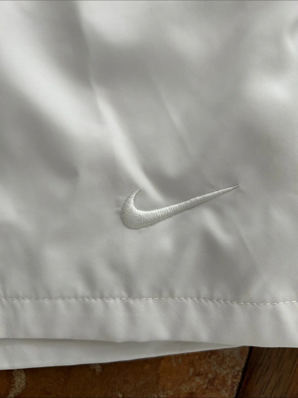 Nike Men’s White Swim Trunks with Subtle Logo